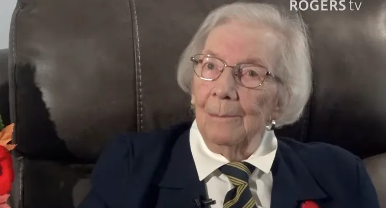 Ruby Somers, one hundred years young, poppy on, telling the whole story. Still from Rogers TV.