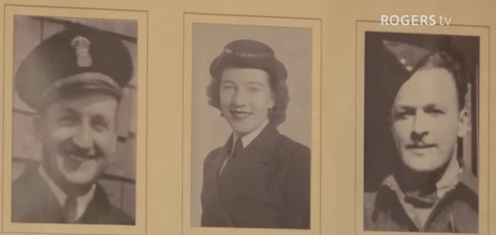 The wall at home: the brothers and the Wren, all in uniform. Still from Rogers TV.
